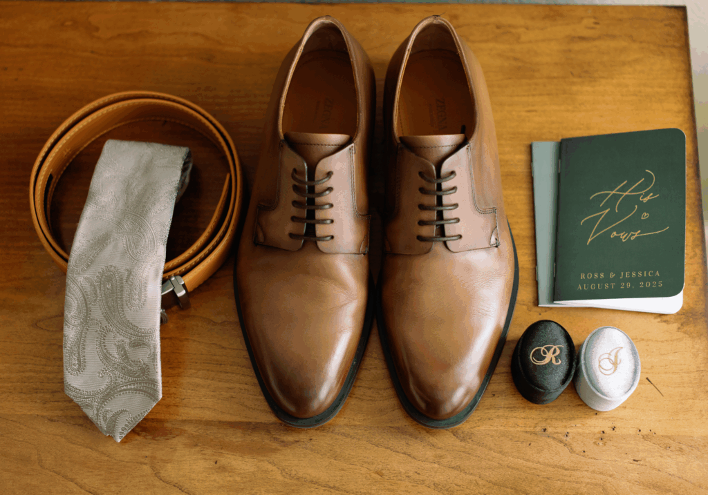 Groom's detail, shoes and vows.